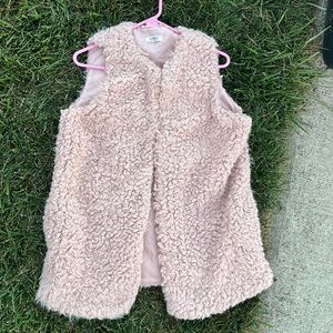This nice furry pink vest hasn’t been worn much at all. Get stylish for Fall!